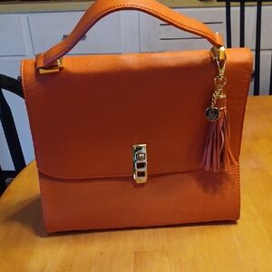 Joy Mangano Orange Leather Handbag with Gold Accents And Tassel RFID Protection